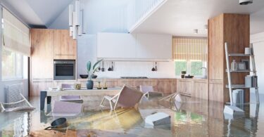 A modern kitchen submerged in floodwater, illustrating the aftermath of a home flood.