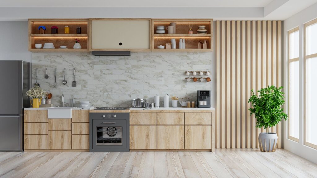 Modern kitchen featuring light oak timber flooring, minimalist cabinetry, and marble backsplash. Includes a stove, sink, and well-organised open shelves, complemented by a large potted plant near bright windows, enhancing the space's natural and contemporary feel.