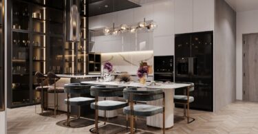 Elegant modern kitchen with a marble island, plush teal bar stools, and sleek gold accents on shelving and fixtures, illustrating upscale home renovations that enhance property value.